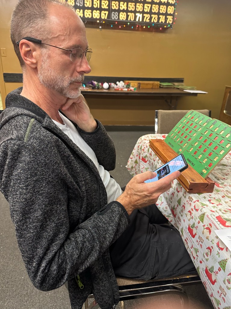 Daniel playing bingo at Southern Trails RV Resort in Unadilla, Georgia. Picture by Happy Vegan Campers.