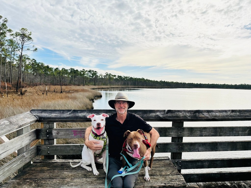 Daniel, Peter, and Marcel at Tarkiln Bayou Preserve State Park in Pensacola, Florida. Picture by Happy Vegan Campers.