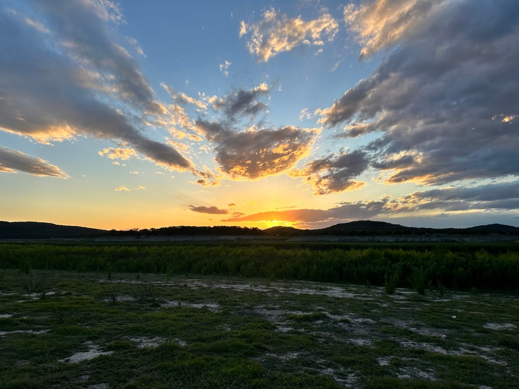 Sunset at Medina Lake RV Campground in Lakehills, Texas. Picture by Happy Vegan Campers.