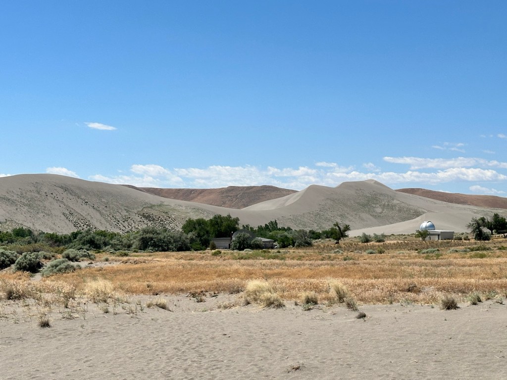 View of sand dunes from campsite 83 at Bruneau Dunes State Park in Bruneau, Idaho by Happy Vegan Campers