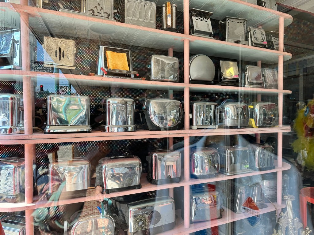 Display of vintage toasters in Astoria, Oregon by Happy Vegan Campers