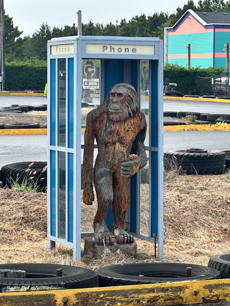 Big Foot in a telephone booth in Long Beach, Washington by Happy Vegan Campers