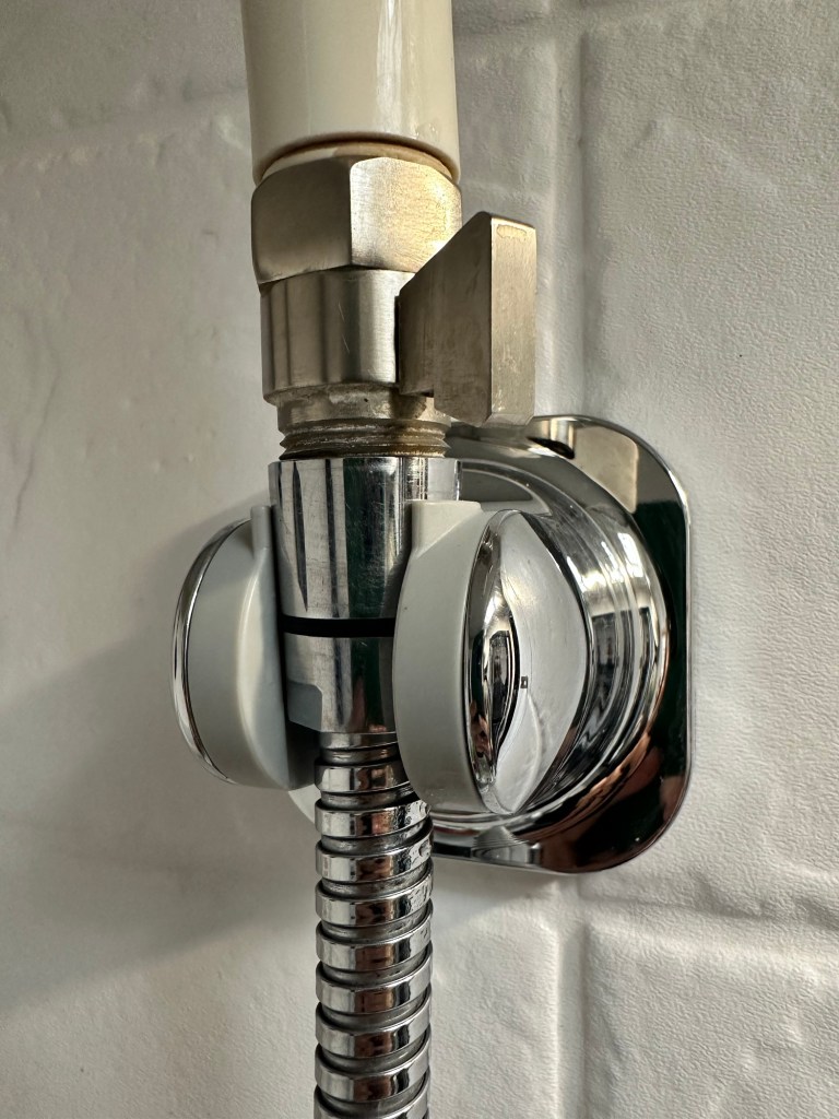 Shower wand holder by Happy Vegan Campers