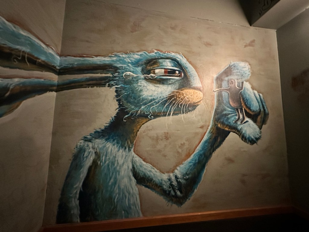 Painting in bathroom at Bye and Bye restaurant in Portland, Oregon by Happy Vegan Campers