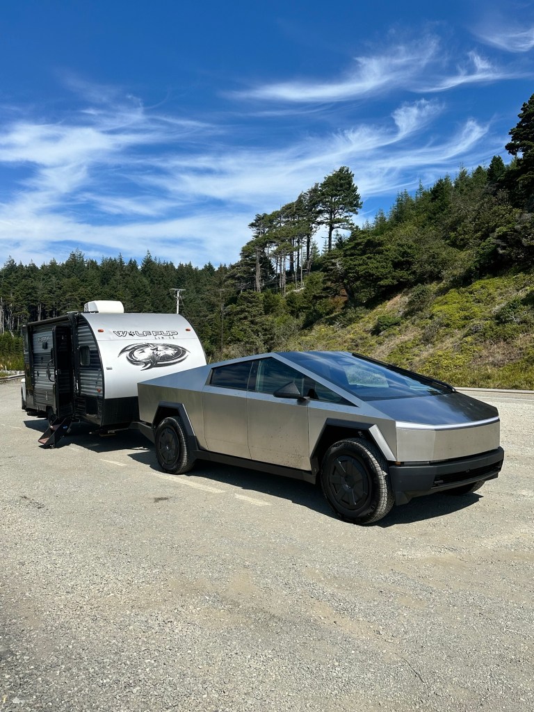 Tesla Cybertruck pulling a camper in Oregon by Happy Vegan Campers