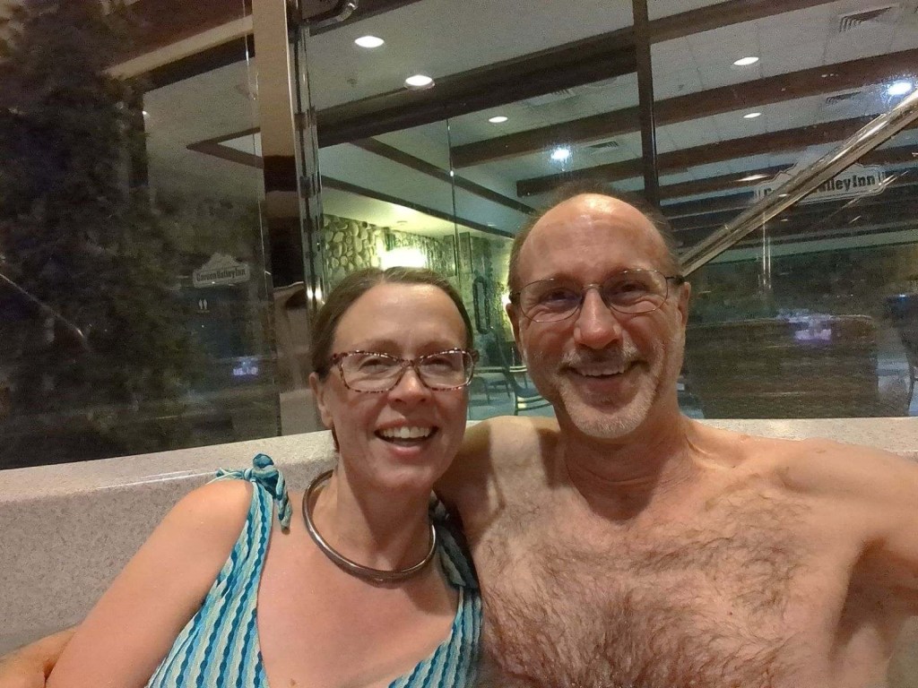 Daniel and Kristin enjoying the hot tub after walking a total of 14 miles by Happy Vegan Campers