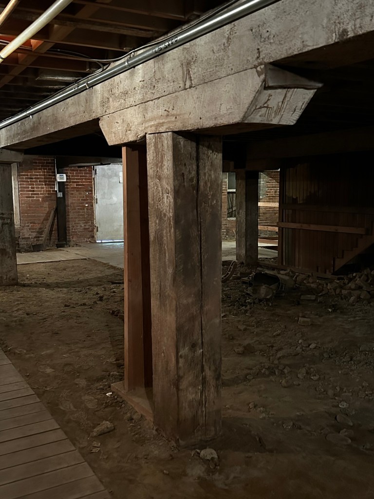 Old beams in the underground area of Old Sacramento, California by Happy Vegan Campers