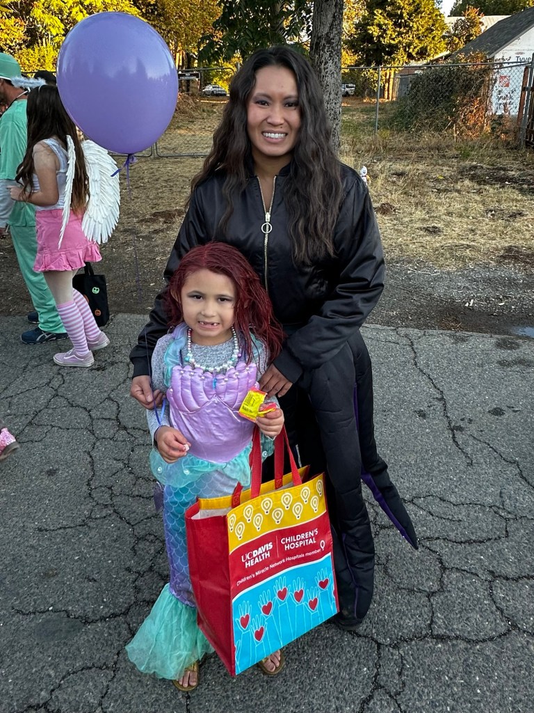 Kim and Kavelia trick-or-treating in Georgetown, California by Happy Vegan Campers