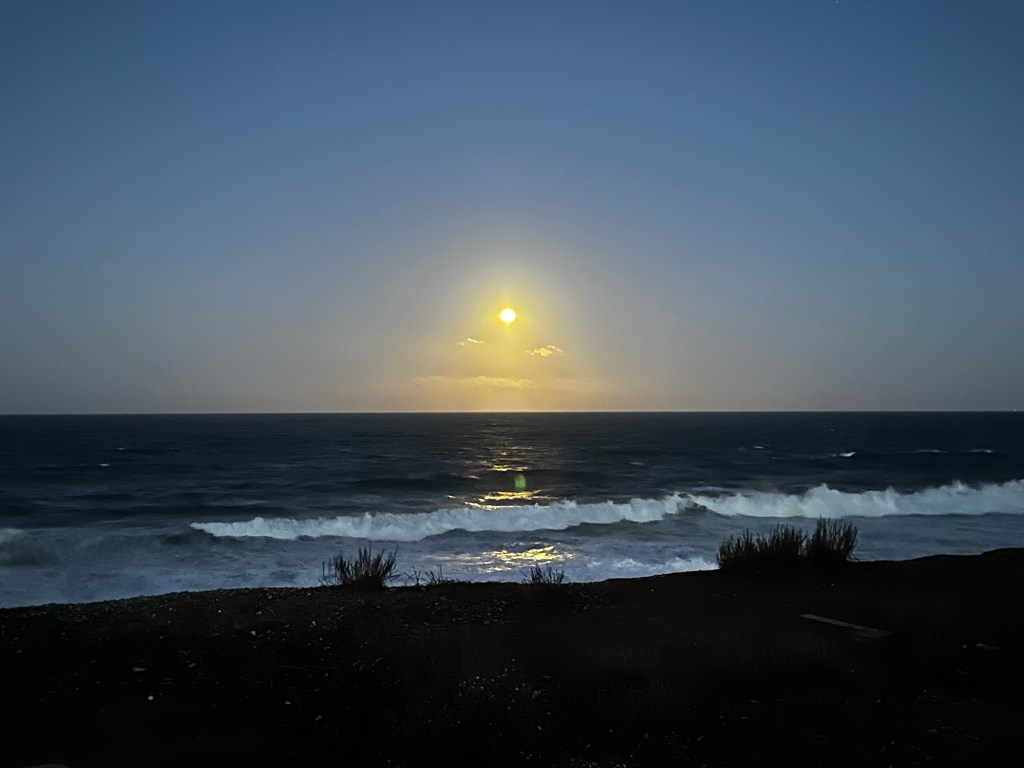 Moon over ocean in Pacifica, California by Happy Vegan Campers