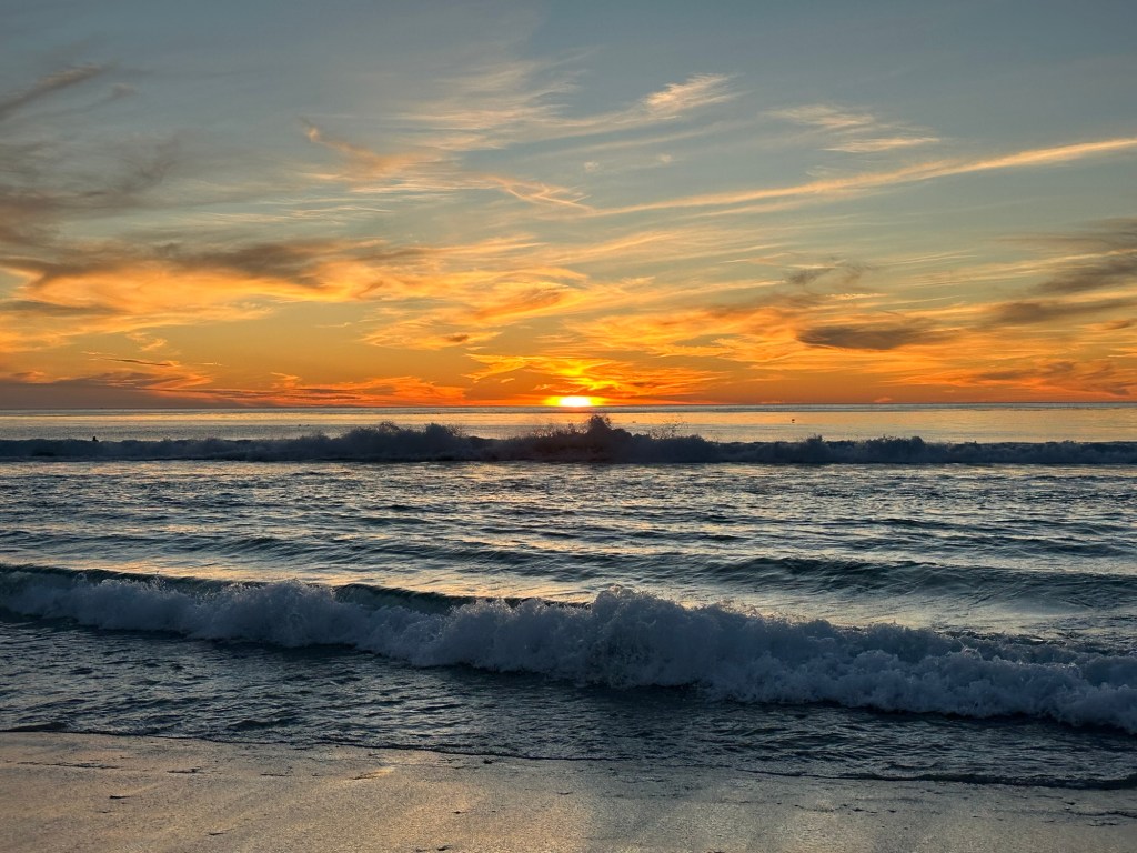 Sunset on the beach in Carmel-by-the-Sea, California. Picture by Happy Vegan Campers.
