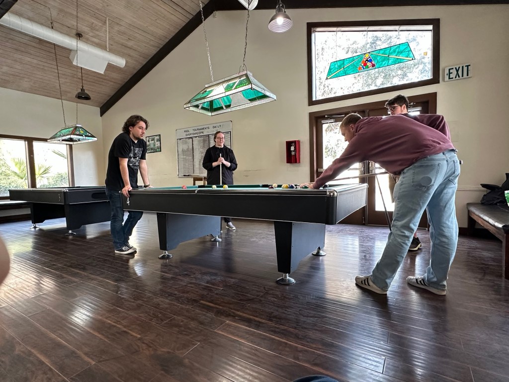 MacKenzie and Alex playing pool at Thousand Trails Soledad Canyon in Acton, California. Picture by Happy Vegan Campers.