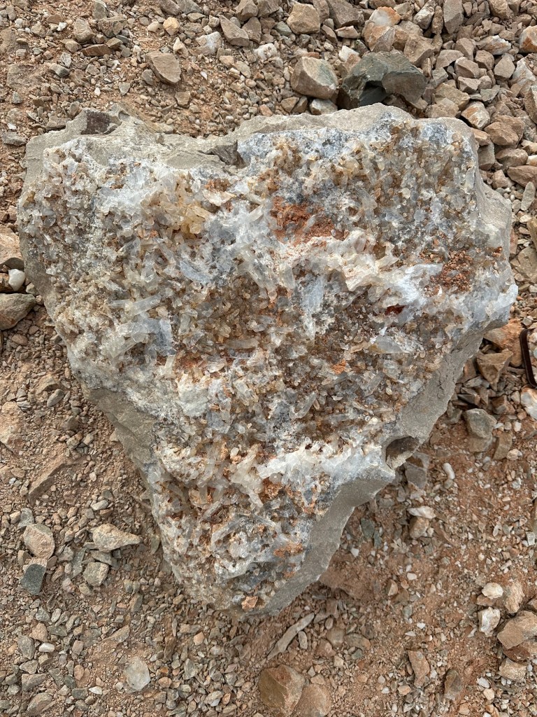 Heart shaped rock covered in crystals near Quartzsite, Arizona. Picture by Happy Vegan Campers.