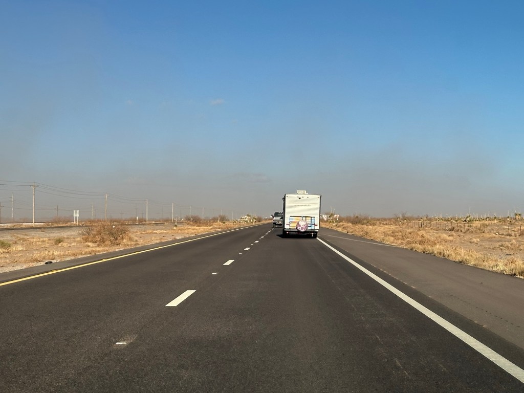 Camper traveling into a dust storm in New Mexico. Picture by Happy Vegan Campers.