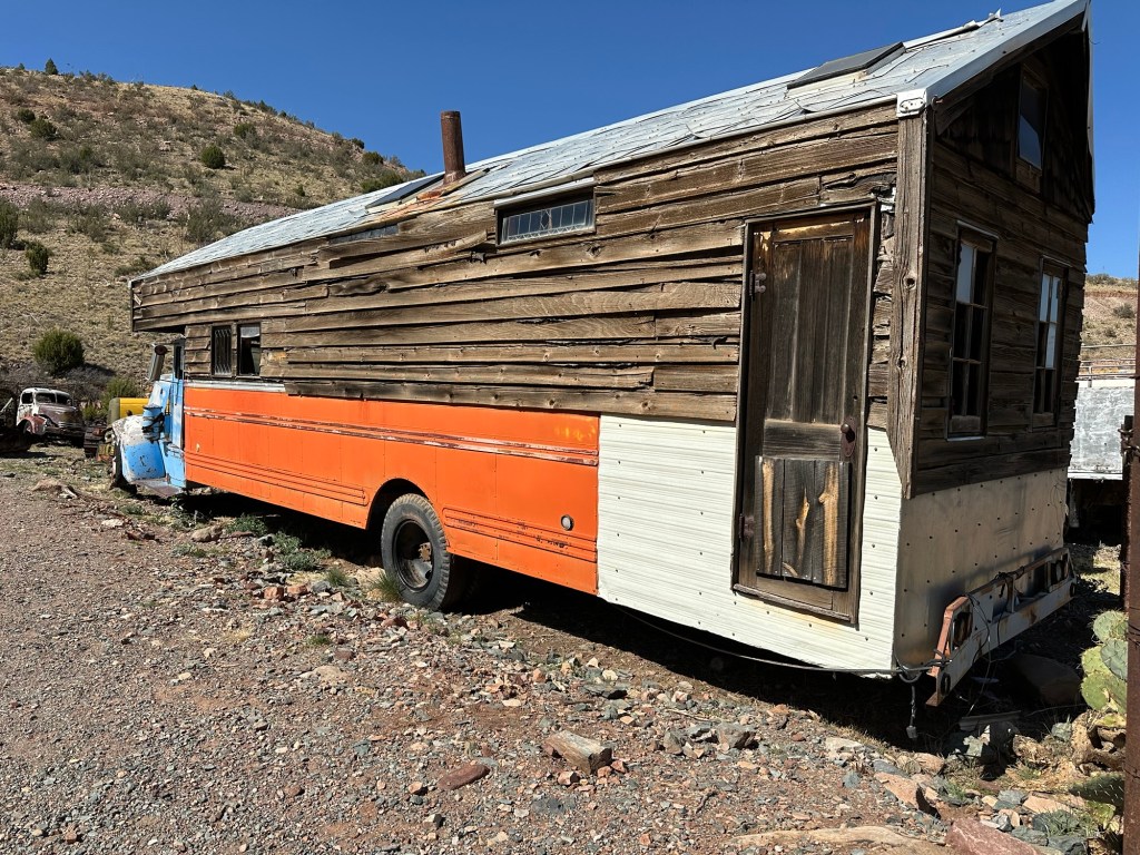 Old converted buses at Gold King Mine and Ghost Town in Jerome, Arizona. Picture by Happy Vegan Campers.