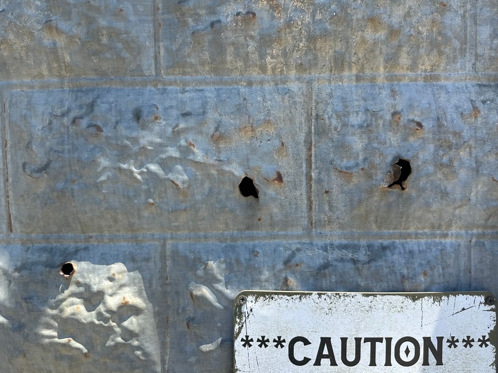 Bullet holes at Pioneer Saloon in Goodsprings, Nevada. Picture by Happy Vegan Campers.