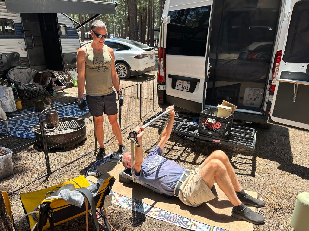 Forrest and Daniel working out using exercise bands at Tahoe Valley Campground in South Lake Tahoe, California. Picture by Happy Vegan Campers.