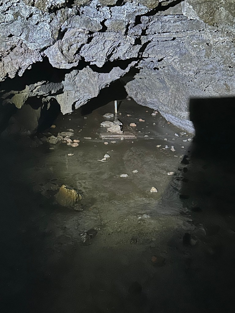Iced over pond in Skull Cave at Lava Beds National Monument in Tulelake, California. Picture by Happy Vegan Campers.