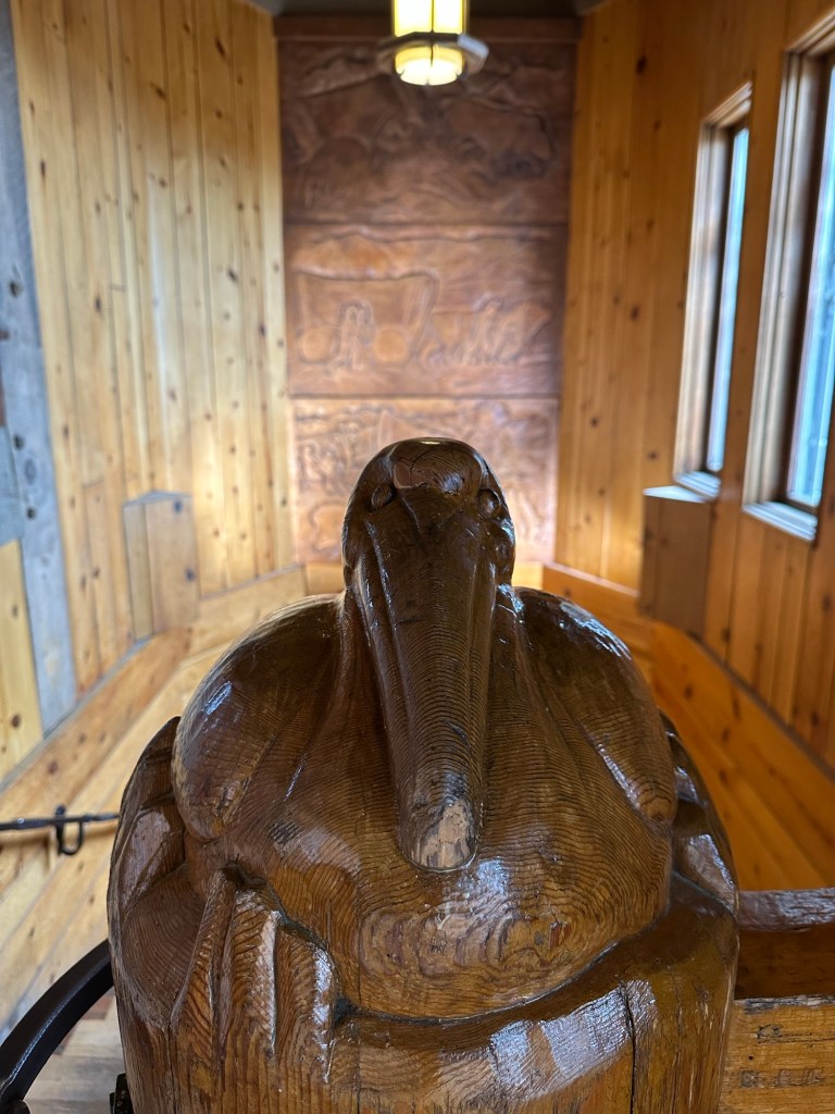 Carved wood newel post at Timberline Lodge in Government Camp, Oregon. Picture by Happy Vegan Campers.