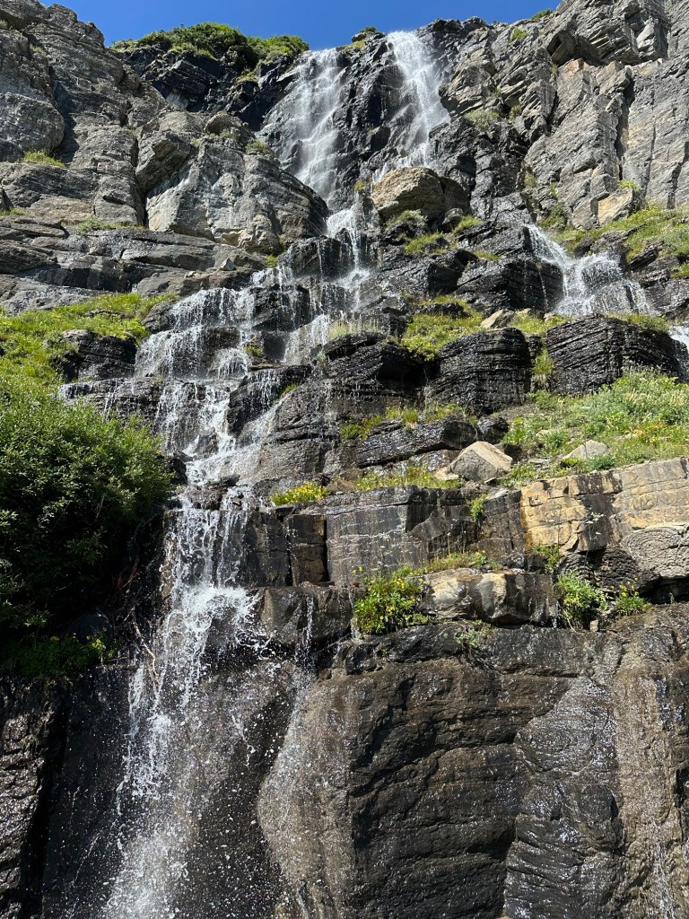 Waterfall next to Going-To-The-Sun Road in Glacier National Park in Montana, USA. Picture by Happy Vegan Campers.