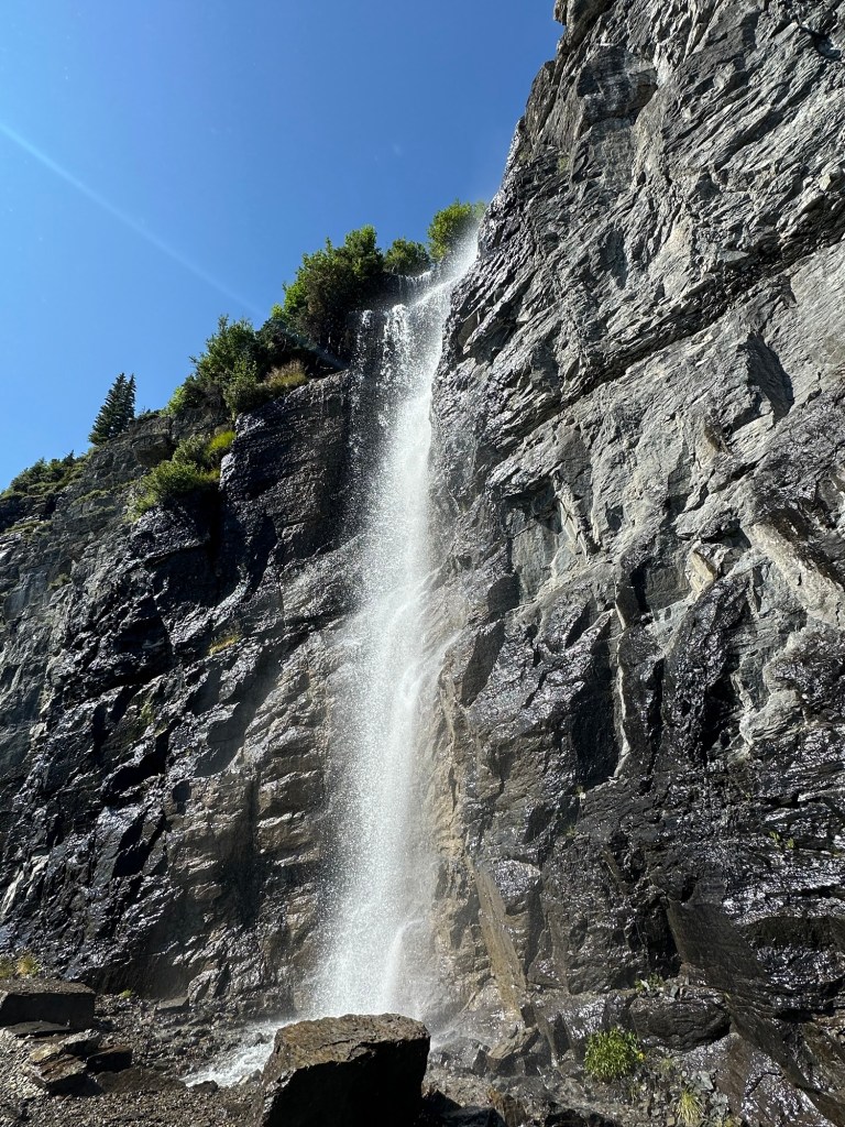 Waterfall next to Going-To-The-Sun Road in Glacier National Park in Montana, USA. Picture by Happy Vegan Campers.