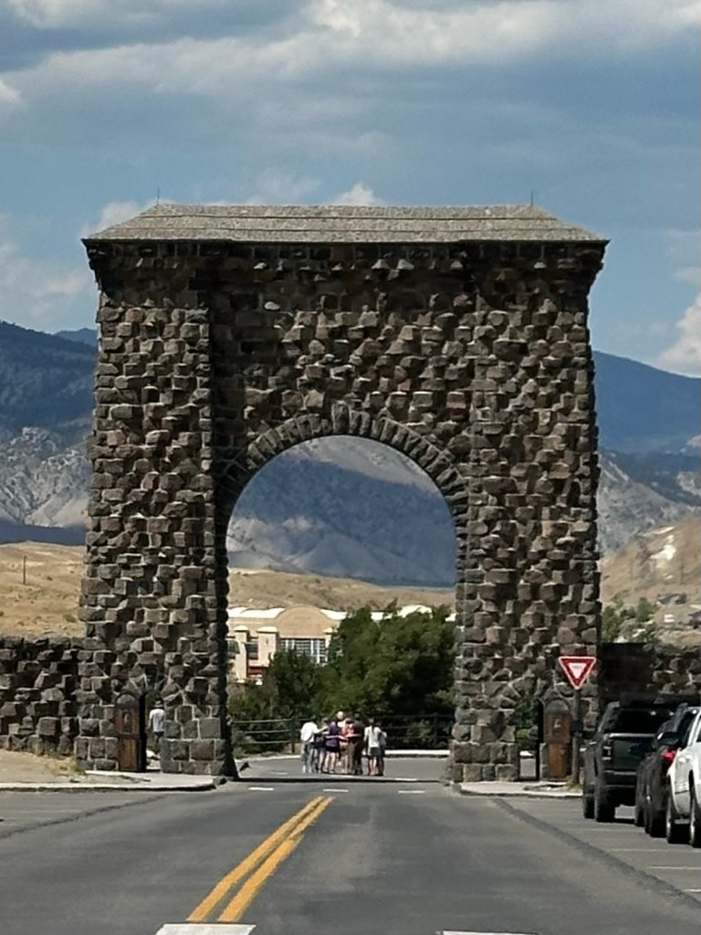 Roosevelt Arch at northern entrance to Yellowstone National Park in Gardiner, Montana, USA. Picture by Happy Vegan Campers.