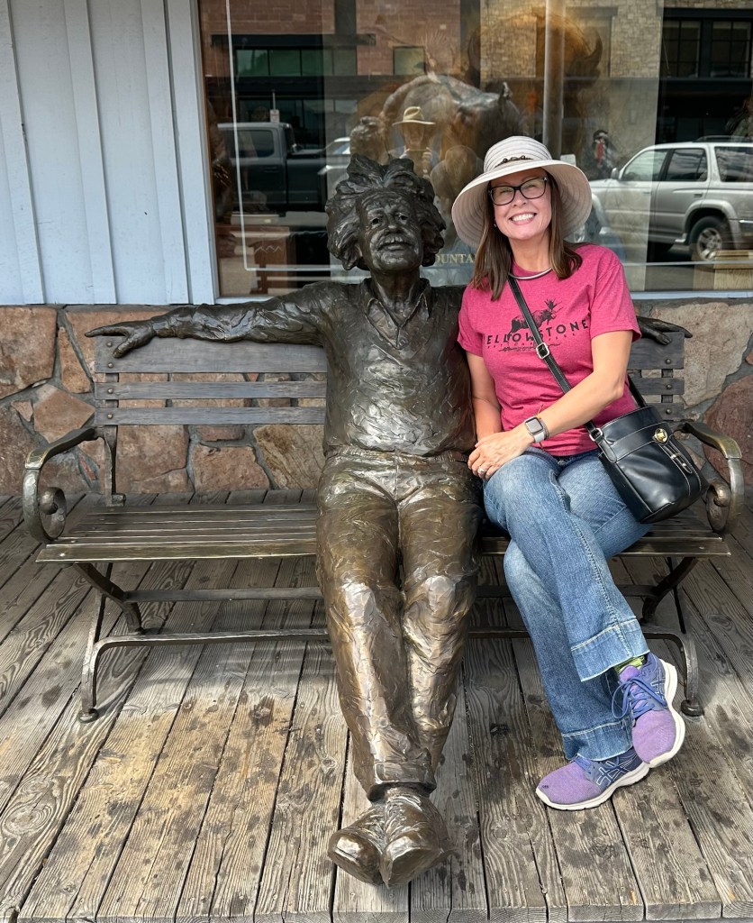 Kristin and statue in downtown Jackson, Wyoming, USA.