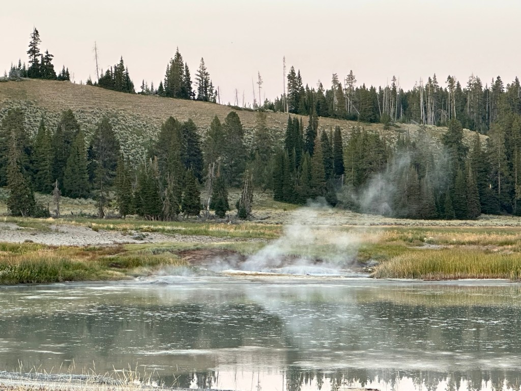 Steam over water in Yellowstone National Park in Wyoming, USA.