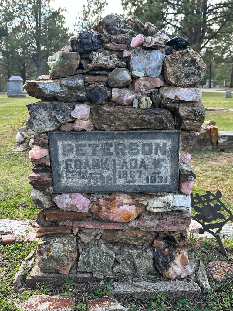 Petrified wood and gemstone headstone in Custer Cemetery in Custer, South Dakota, USA.