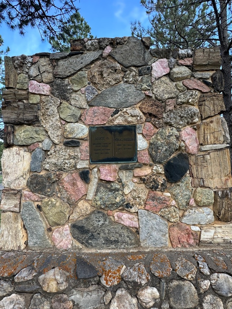 Petrified wood and gemstone headstone in Custer Cemetery in Custer, South Dakota, USA.