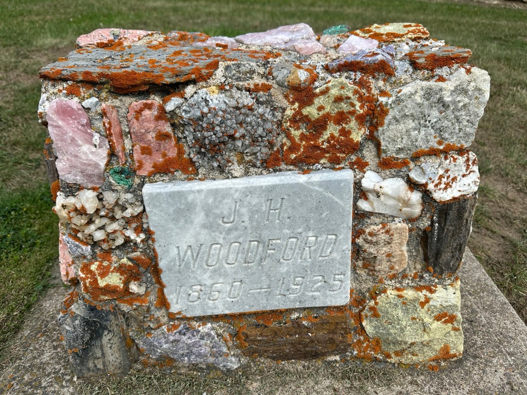 Petrified wood and gemstone headstone in Custer Cemetery in Custer, South Dakota, USA.