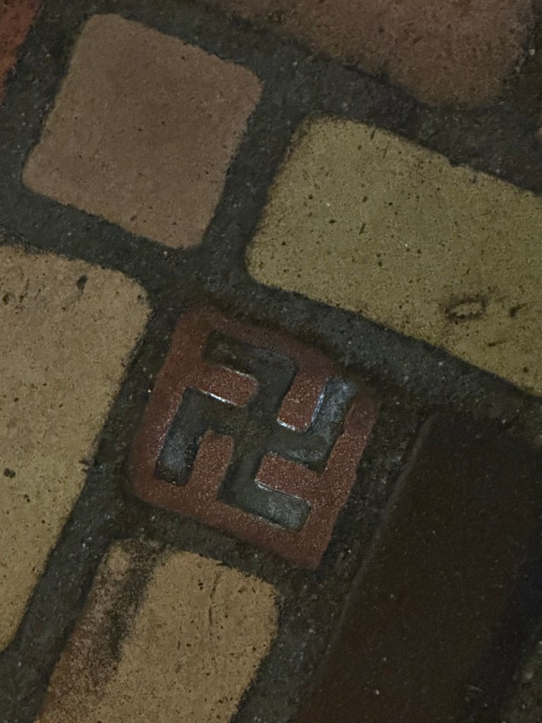 Swastika on floor tile in Hotel Alex Johnson in Rapid City, South Dakota, USA.