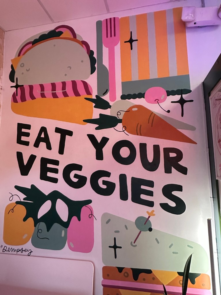 Wall art at Veg.Edible in Omaha, Nebraska, USA.