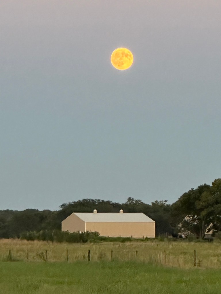 Full moon over a barn in Fremont, Nebraska, USA.