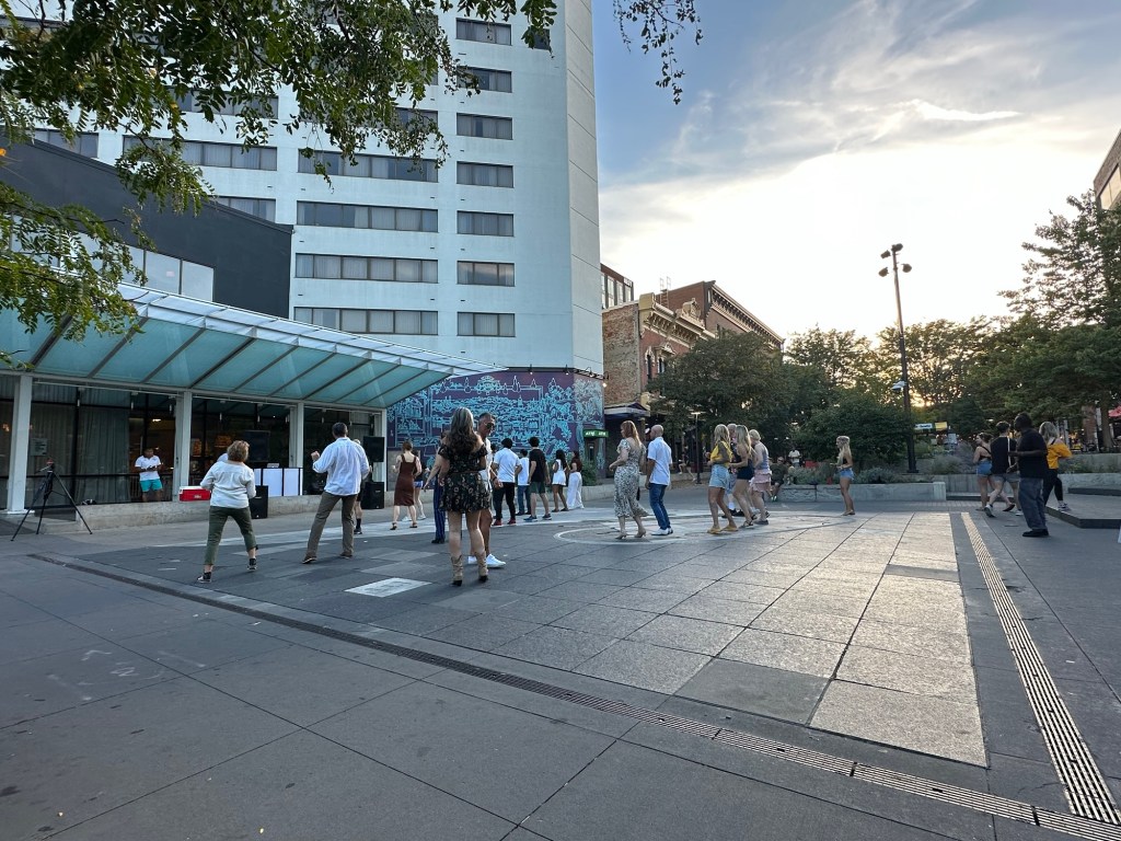 Free salsa dance lessons at Ped Mall in Iowa City, Iowa, USA.